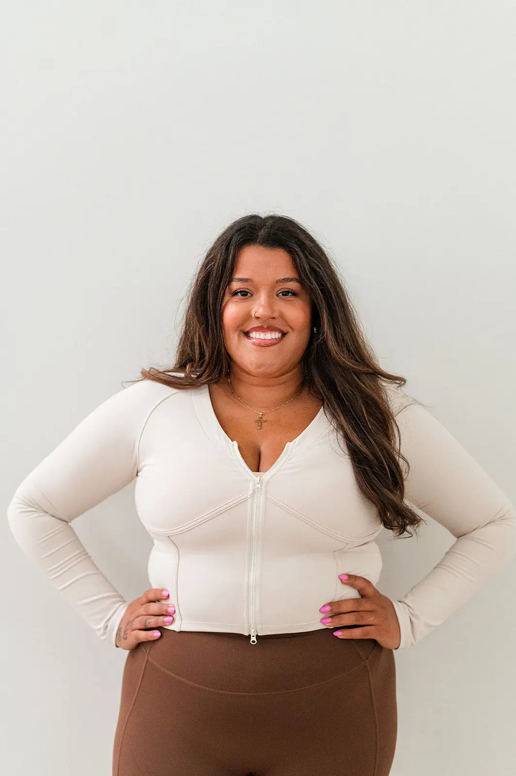 Ivory corset jacket, a chic and versatile piece to elevate your activewear ensemble.