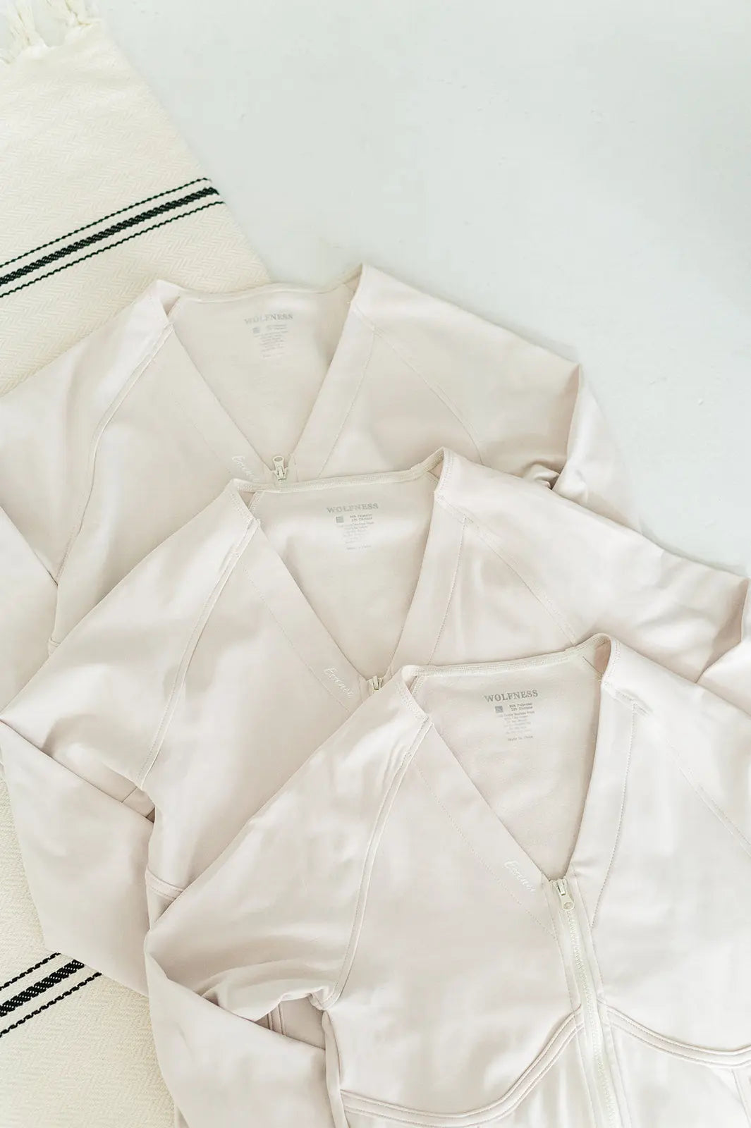 Ivory corset jacket, a chic and versatile piece to elevate your activewear ensemble.