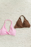 Petal Pink Halter twist sports bra providing support and style for intense activities.